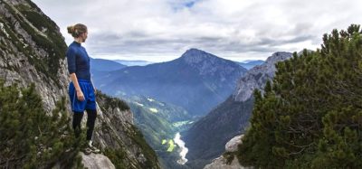 hiker enjoying the view over the Julian Alps