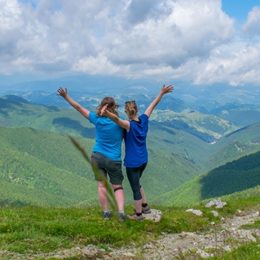 two women enjoying the view over Romanian mountains