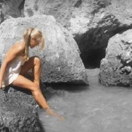 Woman bathing in the natural pool of Courmayeur