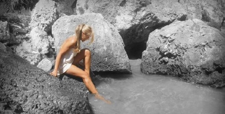 Woman bathing in the natural pool of Courmayeur